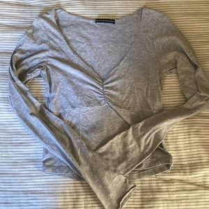 Gray long sleeve top.